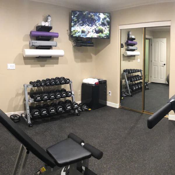 Black energy rubber gym tiles in at-home gym.