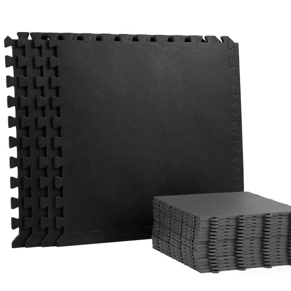 Premium Plus Home Dance Subfloor Kit — black EVA foam interlocking tiles with polypropylene surface, stacked and arranged to