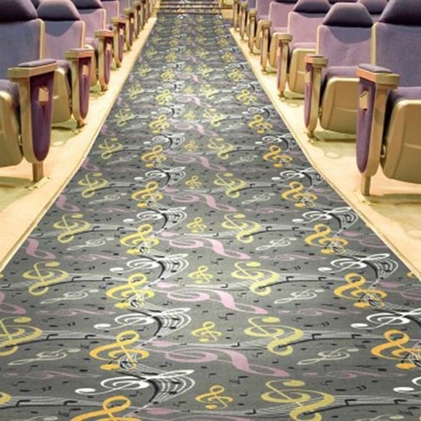 Joy Carpets Virtuoso Carpet, gray with musical note pattern — aisle carpet in auditorium seating area