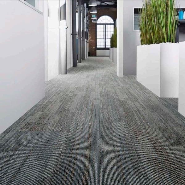 Carpet tiles in hallway of a commercial office.