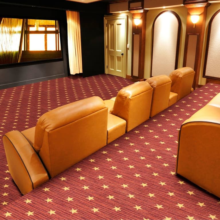 Joy Carpets Curtain Call Carpet, Red — home theater room with plush recliners and star pattern carpet underfoot