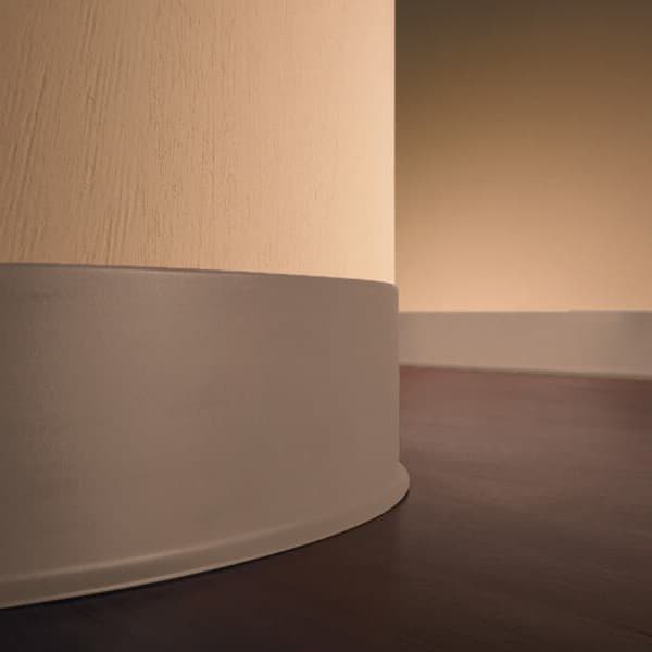 Eco Vinyl Wall Base 4' — gray thermo plastic vinyl trim installed at wall base, curved corner detail