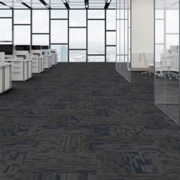 Office space with Patcraft Confidence carpet tiles, dark gray and blue geometric pattern