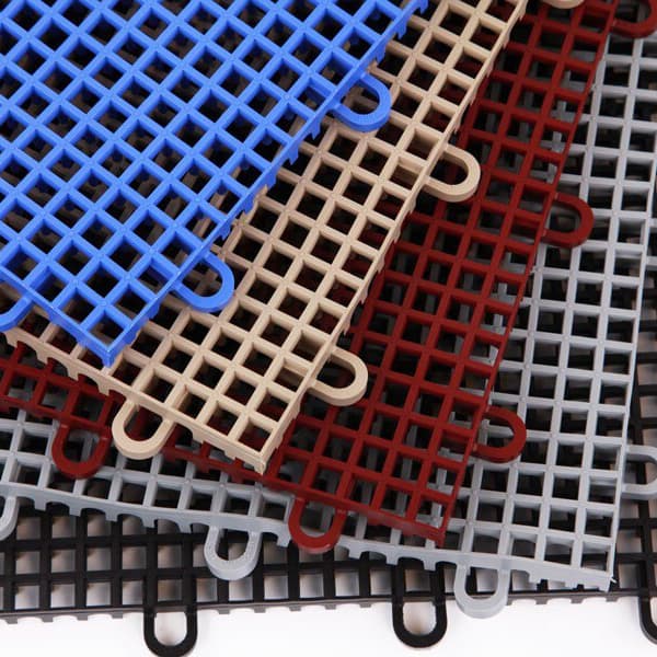 Smooth grip-loc drainage tiles in fan layout with blue, tan, red, gray, and black tiles.