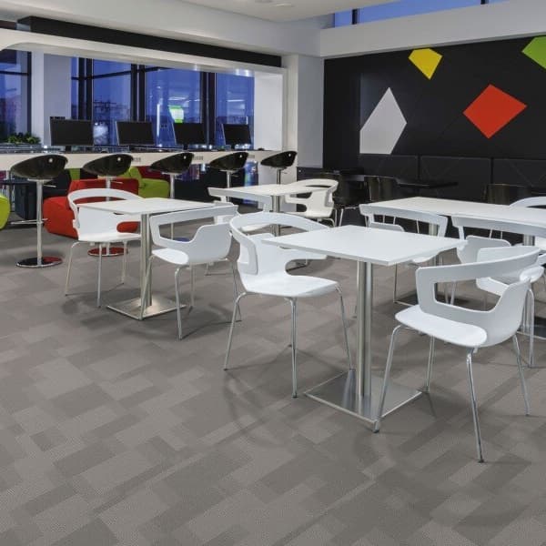 Pentz Amplify carpet tiles in Cloud, geometric pattern in a modern breakroom