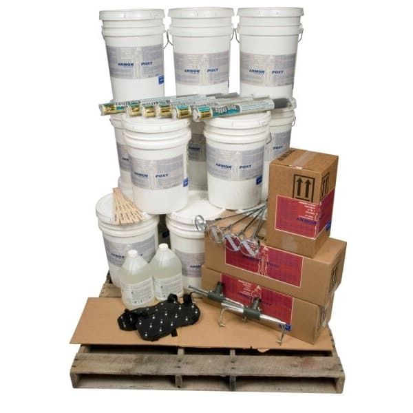 Epoxy floor coating kit on pallet with multiple epoxy buckets, primer containers, boxes of supplies, mixing tools, and rollers.