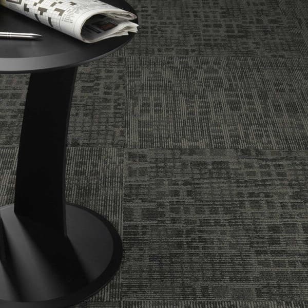 Pentz Techtonic Carpet Tiles, Framework pattern — dark gray textured carpet tile installation in an office setting with a