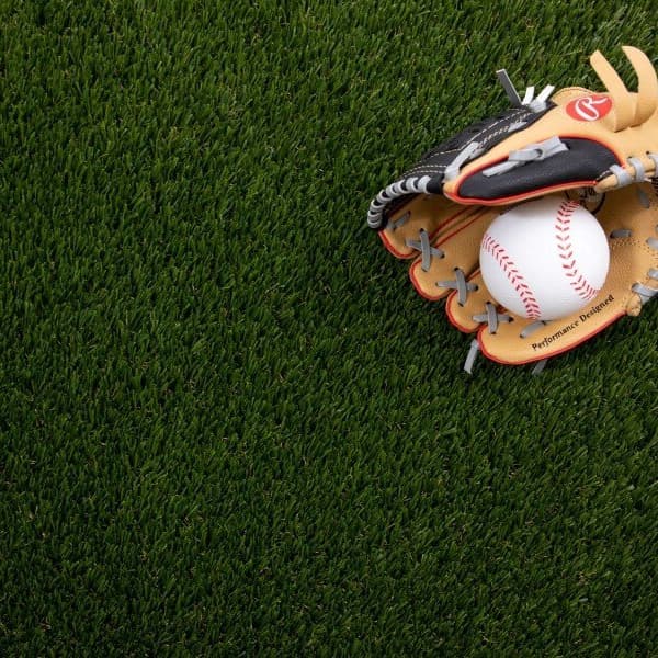 Pacific Safe Play Turf Rolls, Field/Olive Green — artificial grass surface with baseball glove and ball placed on top