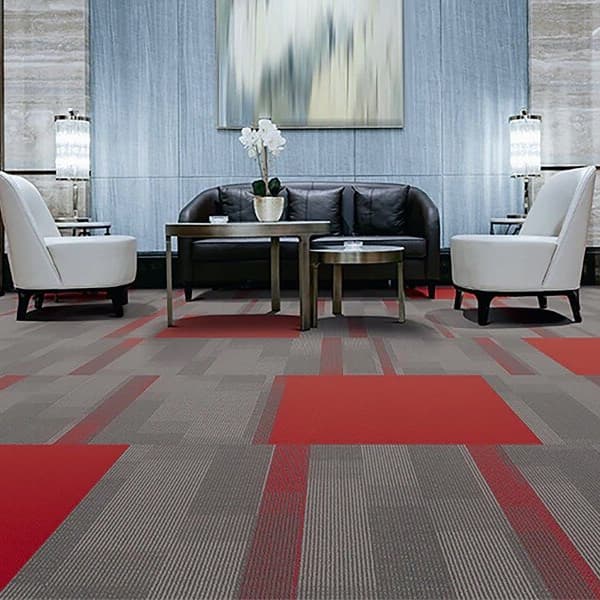Pentz Colorburst Carpet Tile in Chili Red and gray — lounge with seating and tables on patterned carpet tiles