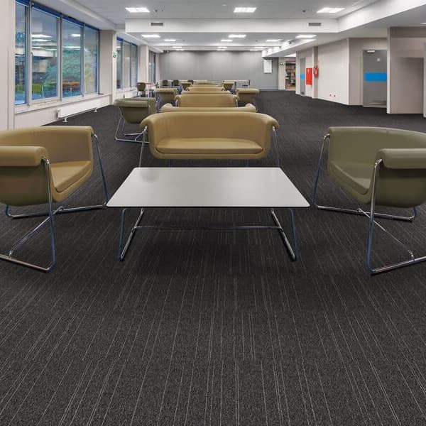 Office lounge with Mohawk Rule Breaker Carpet Tile, Charcoal Stripe
