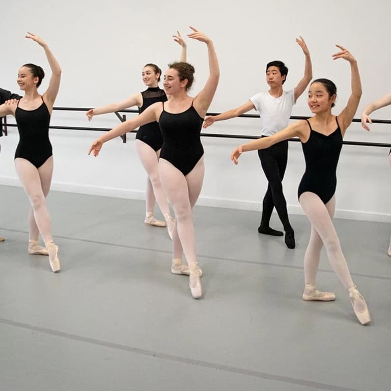 Ballet studio with dancers on gray Rosco dance floor roll, homogeneous vinyl flooring