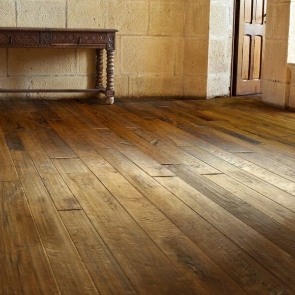 Engineered hardwood in rustic hallway with a wooden table.