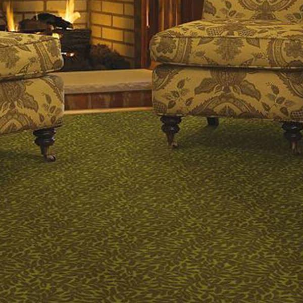 Shaw Suite Retreat Carpet, Shetland — green carpet with a leaf pattern in a living room setting