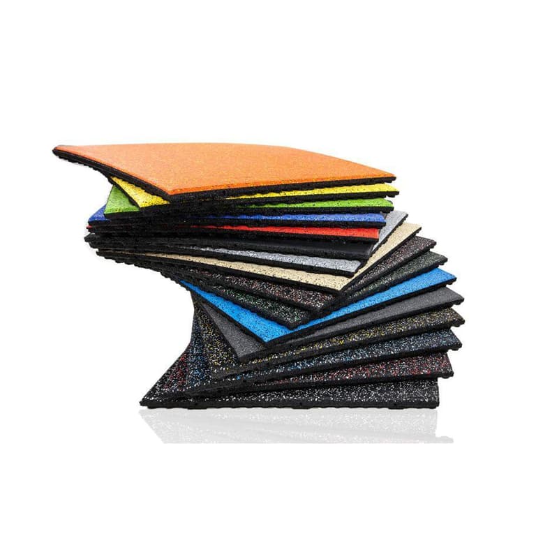 Stacked thick rubber floor tiles in assorted colors.