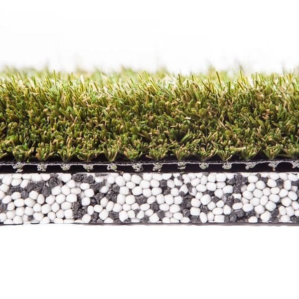 Shaw Play Pad 5 artificial grass — cross-section showing green polypropylene turf over a layer of white and gray cushioning