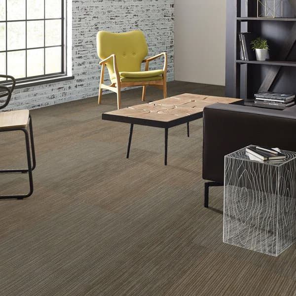 Shaw Document Carpet Tiles, Newsfeed pattern — modern living room with gray wood-look carpet