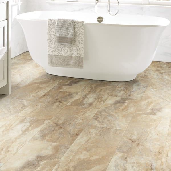 Shaw Paragon Tile Plus 12" rigid core vinyl planks in Oyster — bathroom with freestanding tub and white vanity