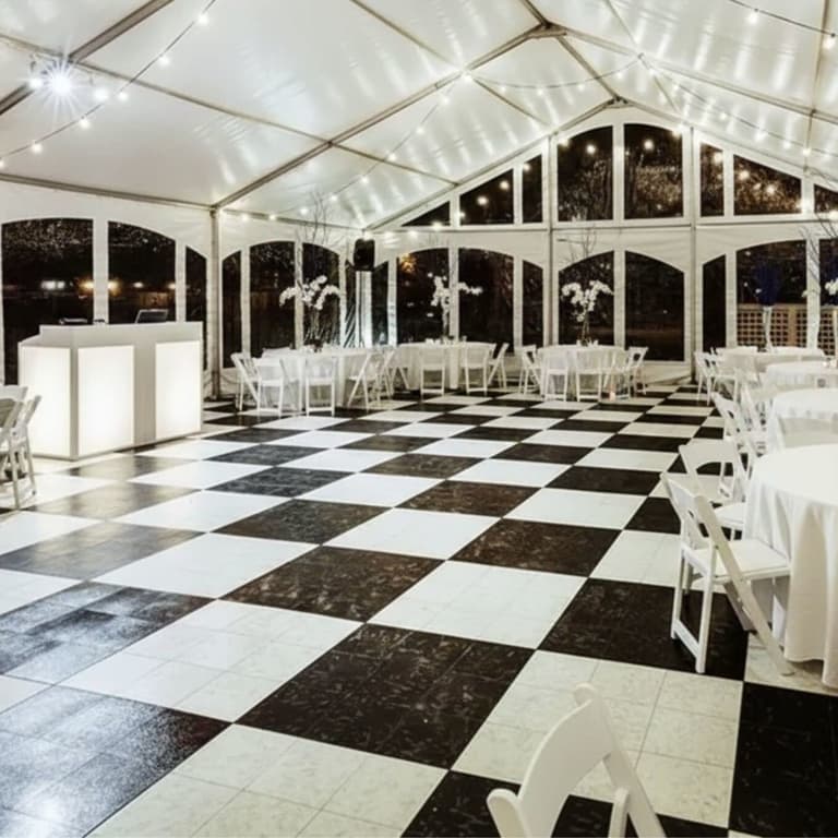 Modular Grid-Loc Tiles™ in Slate Black and White Onyx — checkered dance floor in a tented event space