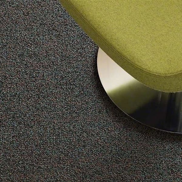 Shaw Scoreboard II Carpet, 1st Down — dark gray textured carpet with subtle flecks under a green upholstered stool base