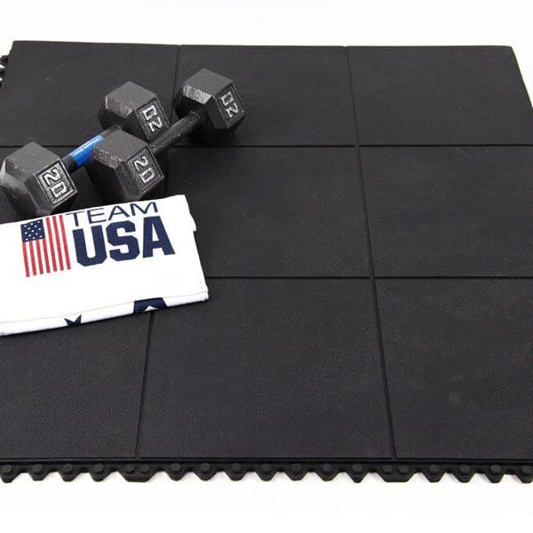 Weights on black, interlocking rubber tiles.
