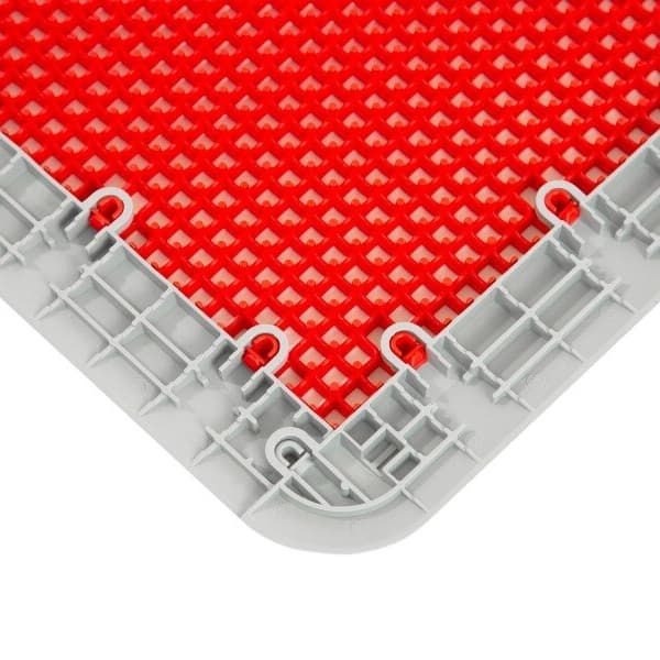 Outdoor Sport Female Corner Edges, gray polypropylene — close-up of interlocking edge detail with red textured tile surface
