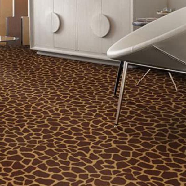 Shaw Giraffe Carpet, Girly Giraffe pattern — living room floor with brown and tan giraffe print under modern furniture