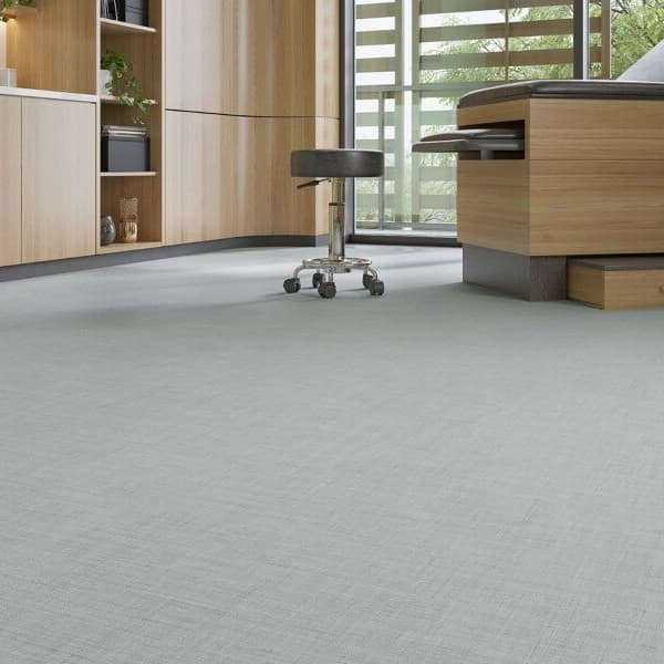 Mannington Wellspring 6' Vinyl Sheet in Tranquility — light gray textured vinyl flooring in a medical examination room