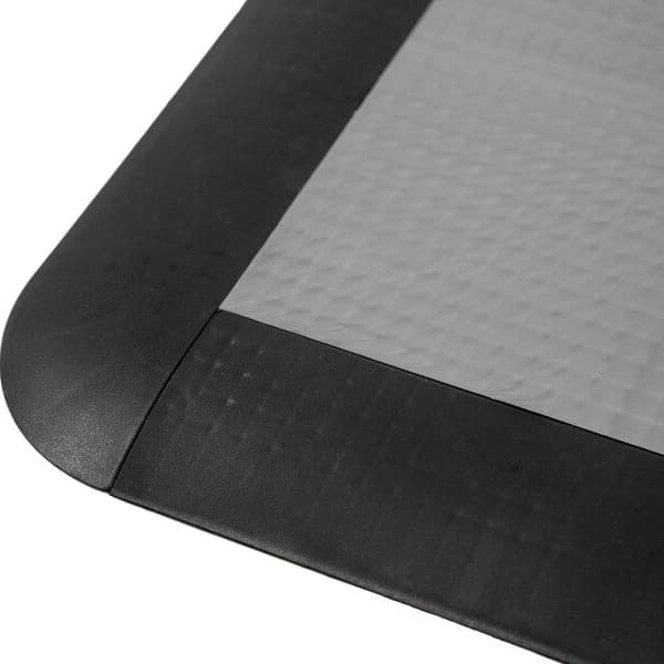 Sport Male Corner Edges, Midnight Black — close-up of rounded black rubber corner edge on textured gray flooring