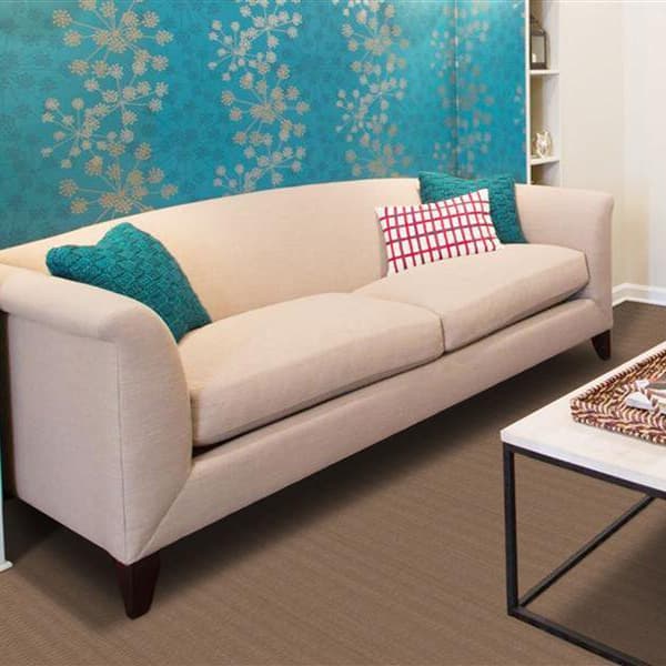 Living room with Foss Ribbed Carpet in a brown hue under a beige sofa