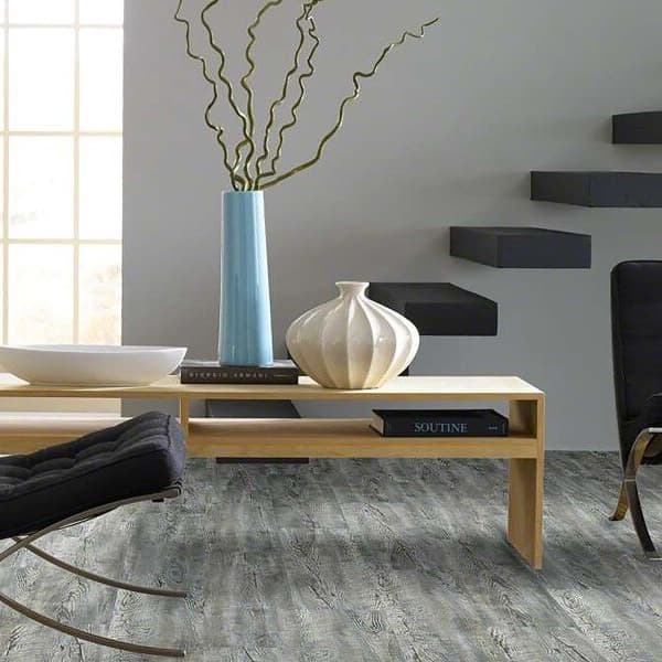 Living room with Shaw Impact Plus Rigid Core vinyl plank flooring in Washed Oak Plus