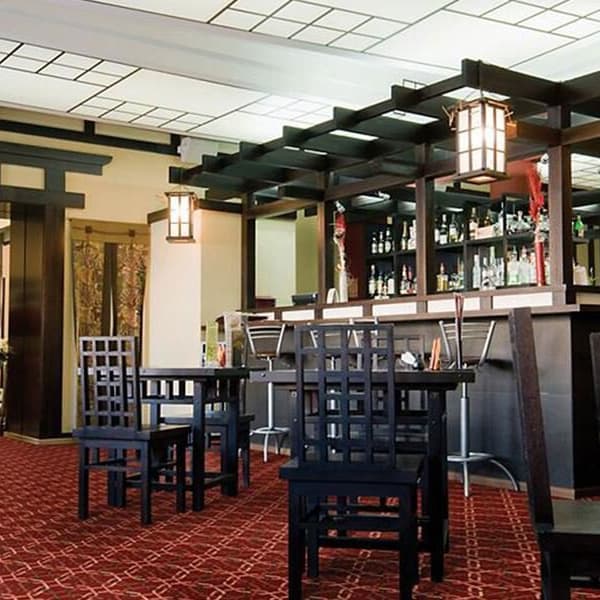 Shaw Ins and Outs Carpet, Mavericks — restaurant interior with red geometric pattern carpet