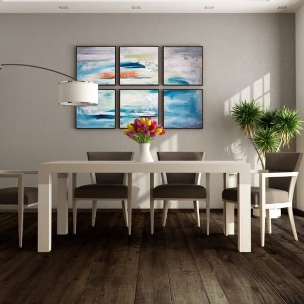 Engineered hardwood in dining room with white table and brown chairs.