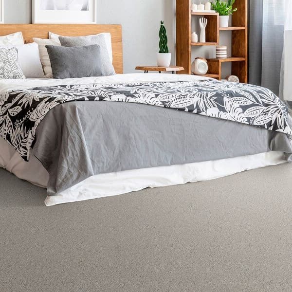 Carpet tiles with padding in cozy modern bedroom.