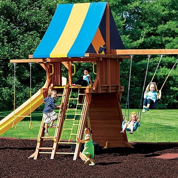 Brown recycled rubber mulch playground surface under a wooden playset with children