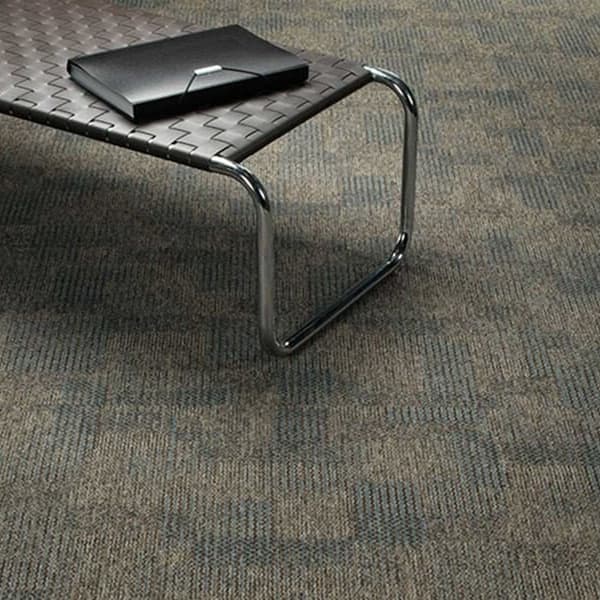 Pentz Revolution carpet tiles in Mutiny pattern on a modern room floor