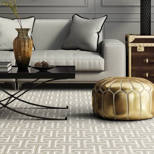 Joy Carpets Park Place Carpet, Dove — living room with geometric patterned carpet
