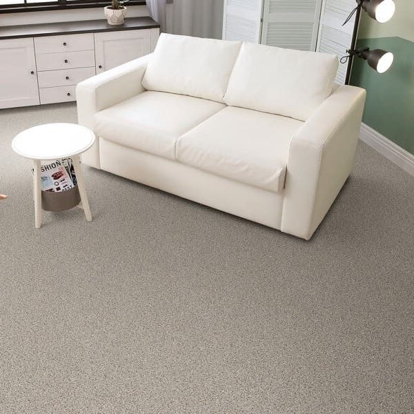 Living room with In a Snap Carpet Tile with Pad, under a white sofa and side table